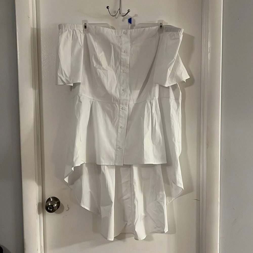 White off the shoulder high-low peplum top.